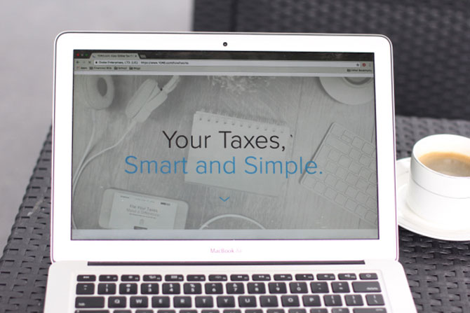 A laptop open to 1040.com is ready to help you file your taxes