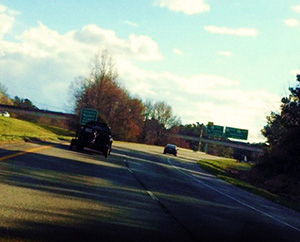 Driving on a winding road in the sunshine