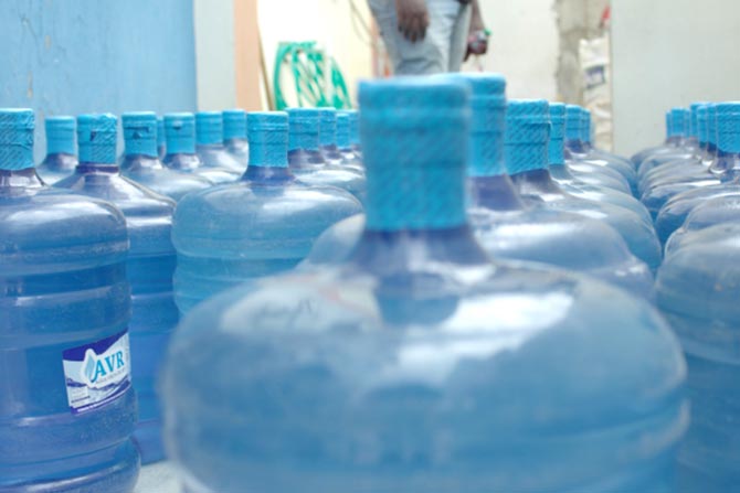 Healing Waters International’s water jugs are lined up and ready to go