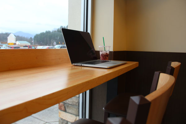 A laptop in a coffee shop is used to research alimony payments.