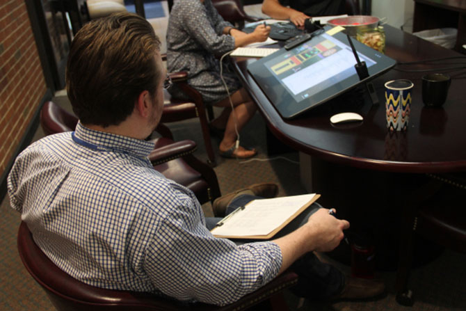 A man prepping his tax info to file with 1040.com