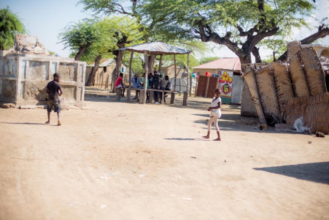 Haitian men gathered in the shade in Lubin, Haiti