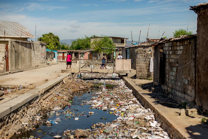 A river in Haiti, clogged with trash