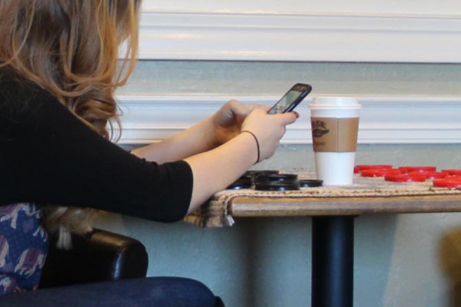 A woman managing her personal finance on her phone