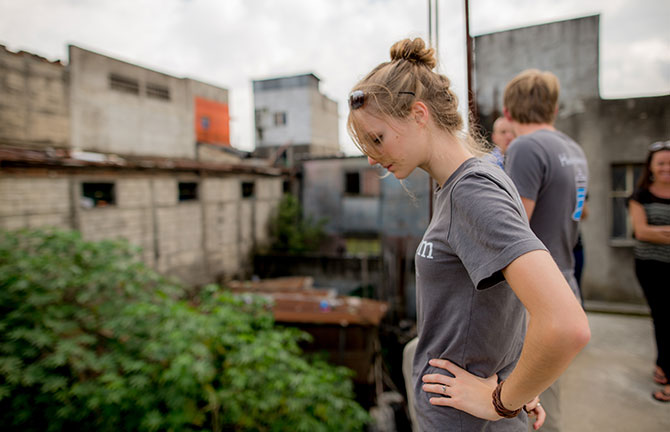 Delainie Golightly looks into a dump in Guatemala City.