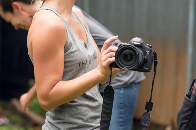 A freelance photographer shows off her camera for 1040.com.