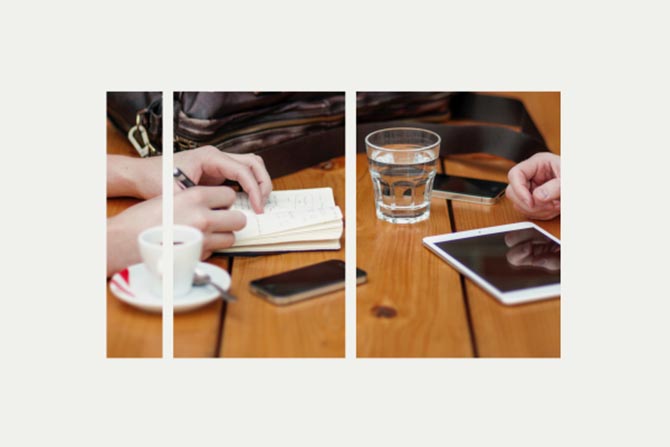 Two people researching refundable credits at a coffee shop