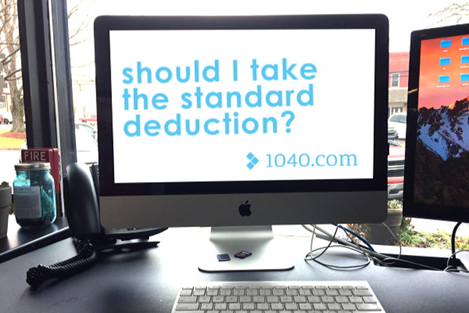 Computer with “Should I take the standard deduction?” on screen