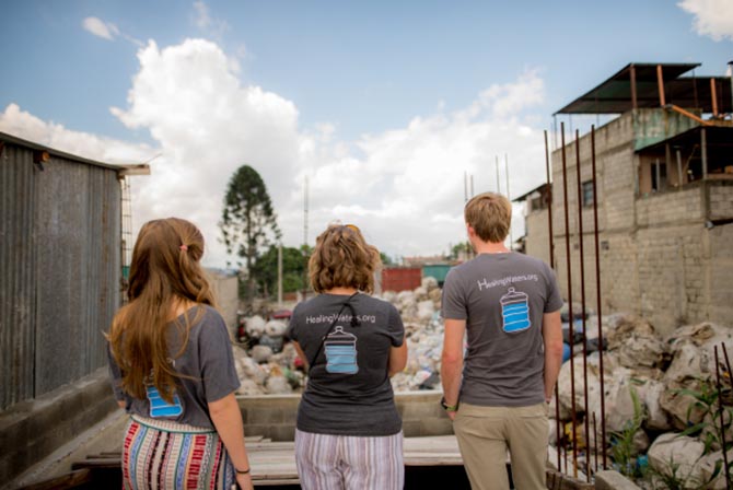 1040.com employees looking out at the city dump