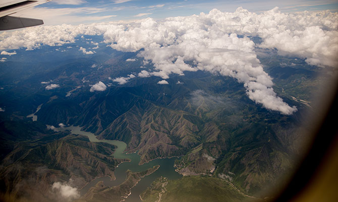 Guatemala stretches in every direction from an airplane window view.