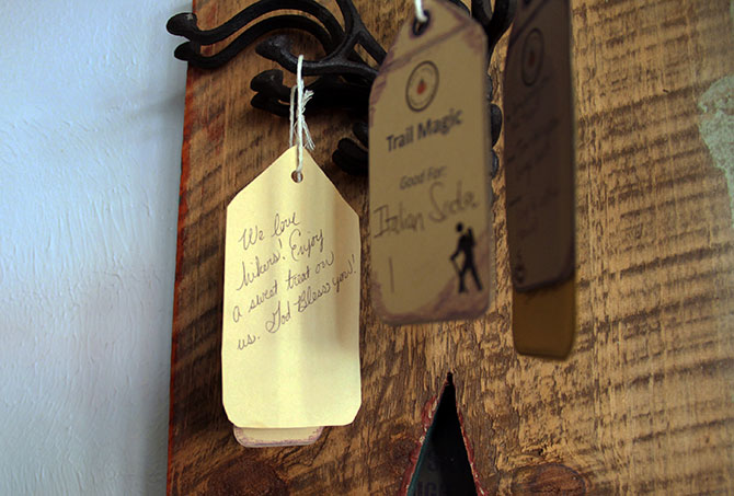 Voucher tags help coffee house customers “pay it forward” to local hikers.