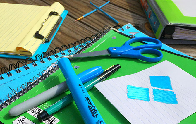 Highlighters, notebooks, and binders organize your personal finances.