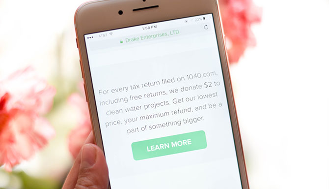 A girl files her taxes on the 1040.com tax filing app.