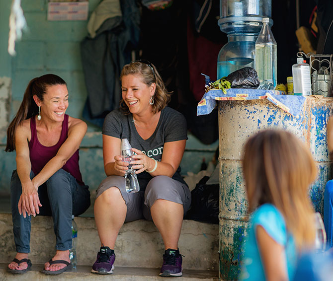 A 1040.com employee talks with a Healing Waters International field worker in Guatemala.