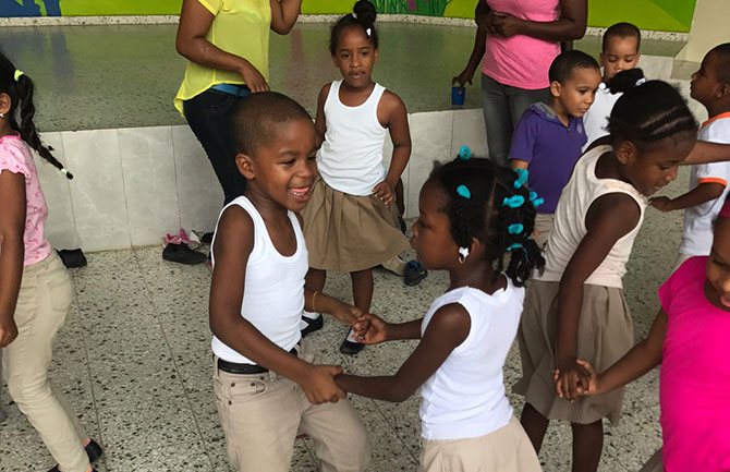 Kids at the Almendro daycare center groove at a dance party.